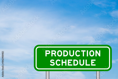 Green color transportation sign with word production schedule on blue sky with white cloud background