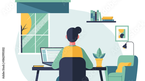 Woman working on laptop in a cozy home office environment