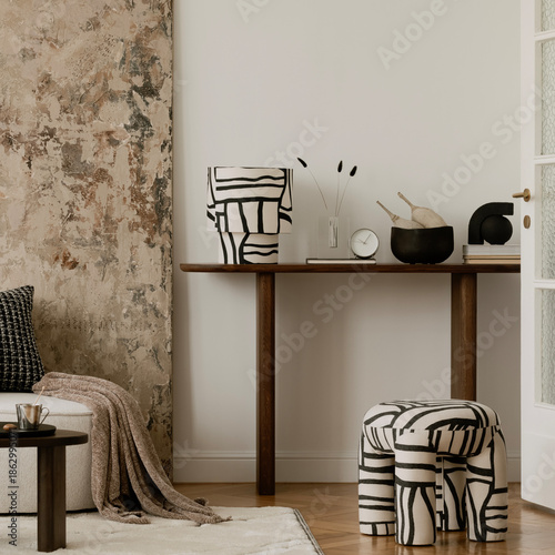 Stylish interior with abstract patterns, earthy tones, and sculptural furniture in a contemporary setting.