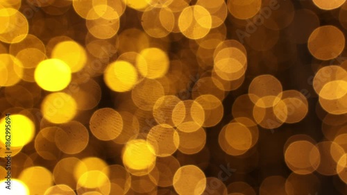 Abstract blurred golden light circles form a bright shimmering texture, ideal for luxury themes, New Year celebrations, digital wallpapers and stylish advertising layouts.