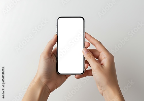 person holding a smartphone with a blank screen in both hands
