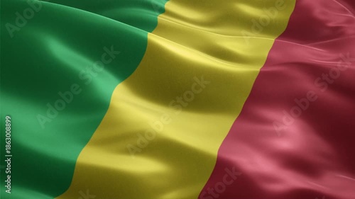 National flag of the Republic of the Congo waving in a seamless loop with diagonal green, yello,w and red stripes