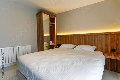 hotel room with bed and lights