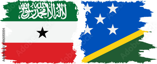 Solomon Islands and Somaliland grunge flags connection, vector