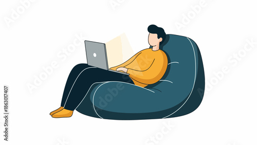 Relaxed young adult working on laptop in comfortable bean bag chair