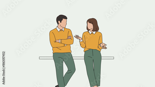 Man and woman in casual office attire engaged in conversation