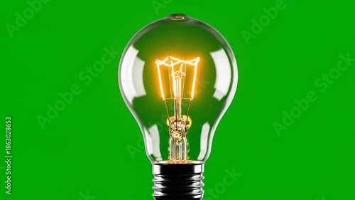 Isolated three dimensional model of a generic glowing incandescent light bulb slowly rotating against a chroma key green screen background idea, isolation, 3d render