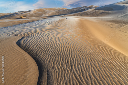 Winter landscape at sunrise of the Silver Lake Sand Dunes, Silver Lake State Park, Michigan, USA