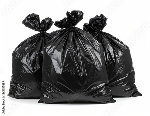 Three tied-up black plastic refuse sacks, isolated on a white background