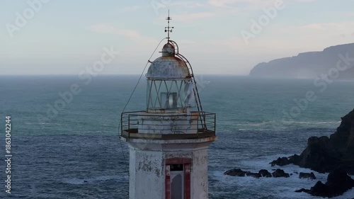 Historic Old Lighthouse Standing At Punta Candieira (Candelaria) Near Cedeira, Galicia, Spain. Aerial Close-up Shot
