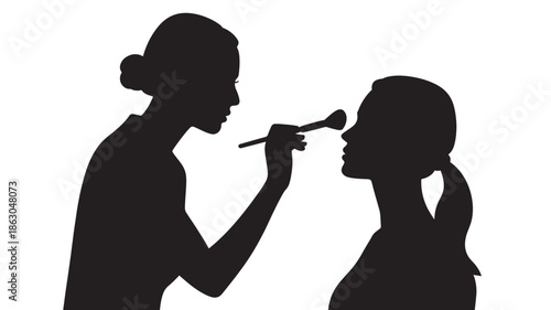 Makeup Artist Applying Cosmetics to Womans Face in Silhouette