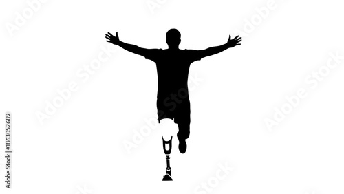 Man with prosthetic leg jumping with outstretched arms