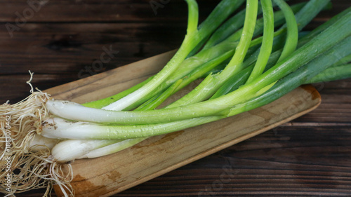 Closeup of some fresh Leeks with the white bulb and roots