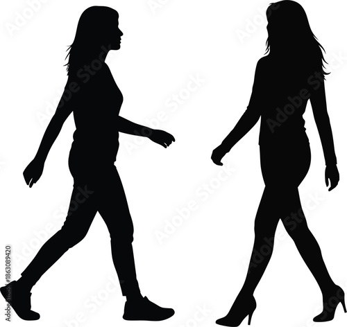 Silhouettes of two women walking in different postures