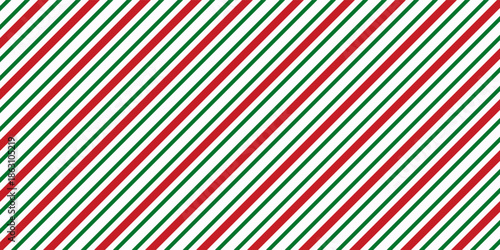 Christmas seamless pattern in classic candy cane design with red and green diagonal stripes on transparent background with 16x9 aspect ratio.
