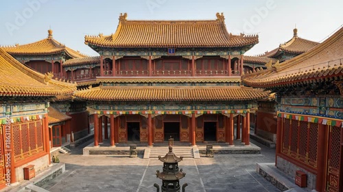 Majestic Ancient Tibetan Buddhist Temple Courtyard With Intricate Architecture And Prayer Flags Under Clear Blue Sky