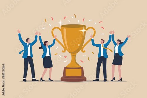 A diverse business team celebrates a major achievement by standing around a large golden trophy