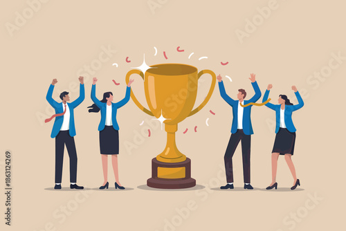 A team of business professionals celebrating their success with a golden trophy