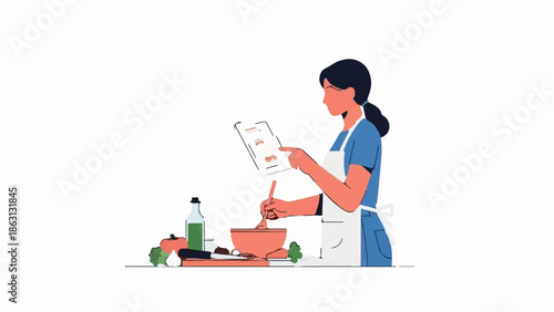 Person following recipe on tablet and mixing ingredients in bowl