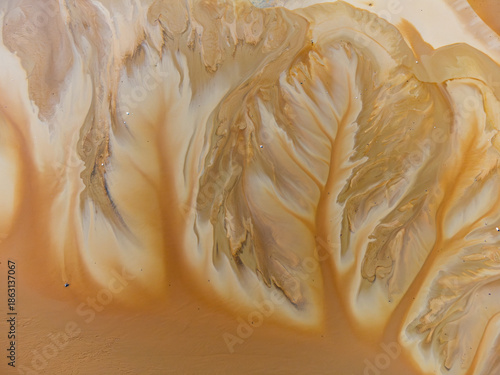Beautiful aerial pattern of colorful water and mud, shot with a drone located at Geamana, Romania, a formerly village that was covered with toxic waste from a mining operation nearby