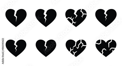 A collection of black heart shapes some whole and some broken displayed neatly
