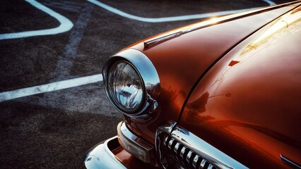 Leinwandbilder Oldtimer Orangefarbener Retrowagen mit Vintage-Scheinwerfer  © Rimma
