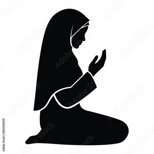Muslim woman praying in silhouette