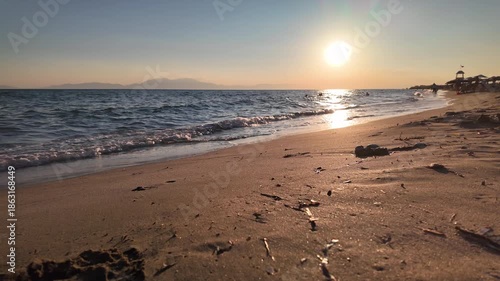 View of a beautiful sunset at the sandy beach of Vergia in Chalkidiki Greece in slow motion