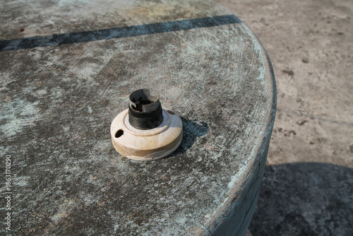 Old Light Bulb Socket on a Weathered Concrete Table