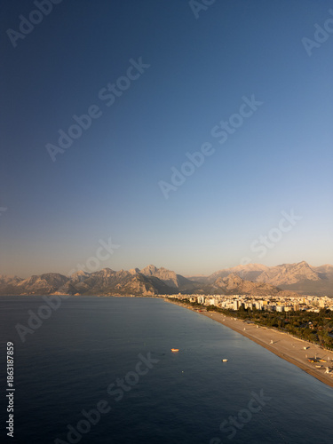 Flying over green mountain ridges towards the rising sun