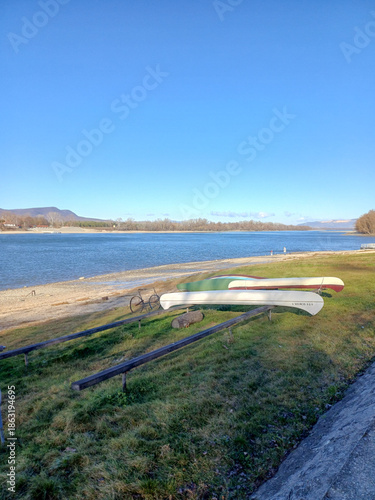 Quiet Riverbank With Moored Boats