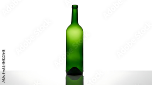 Empty green wine bottle with reflection on a white surface, studio shot