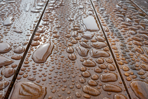 Water droplets on wooden surface with perspective