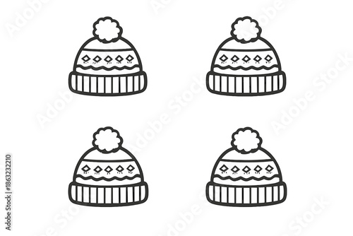 Four knitted winter hats with pom-poms