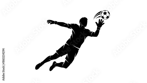 Silhouette of a soccer goalkeeper diving to catch the ball during a game.
