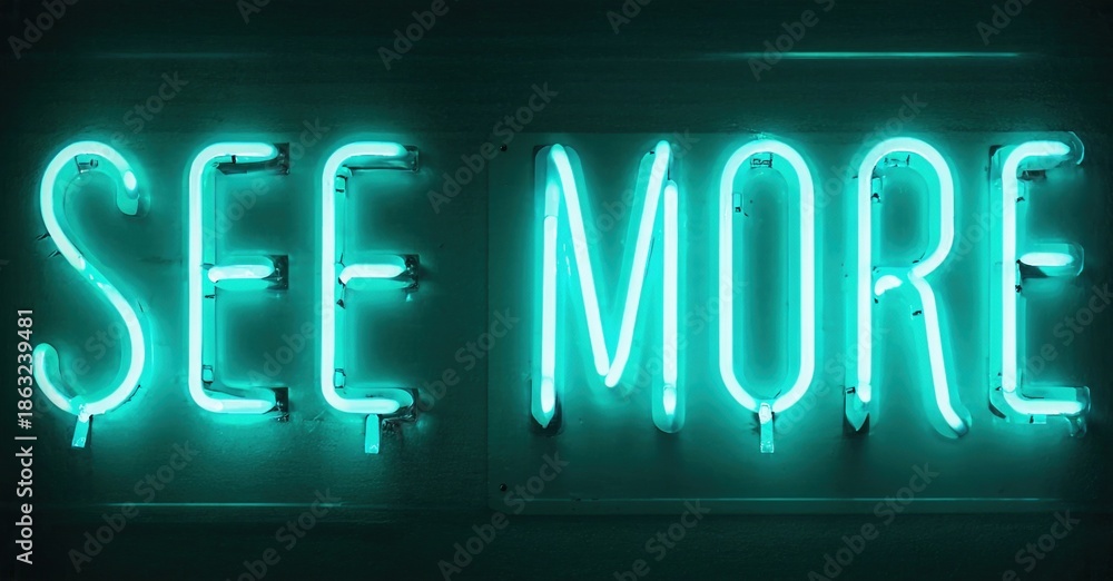 Fototapeta premium Bright turquoise neon sign displays words See More. Dark background emphasizes glowing text. Simple, direct message.