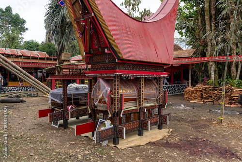 Torajan coffins under the miniature Tongkonan building during Rambu Solo ceremony. Rambu Solo is a ceremonial death Toraja society.
