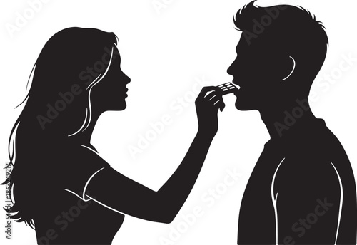 Couple Sharing Food Intimately in Silhouette Style