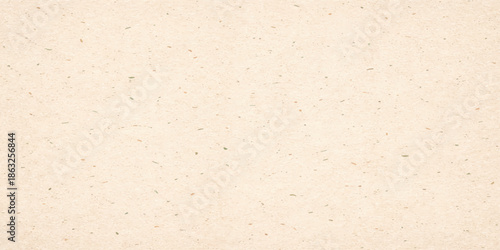 Aged brown parchment with a rough vintage paper texture and grunge cardboard pattern provides a blank recycled material surface for an empty beige design backdrop