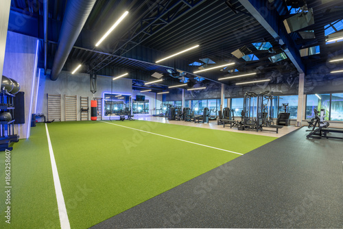 Wallpaper Mural Modern Gym Interior Featuring State-of-the-Art Fitness Equipment and Turf Area Torontodigital.ca