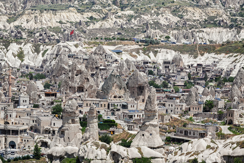 Panoramic view of Goreme town in Cappadocia, Turkey with fairy chimneys and stone houses carved into volcanic rock formations
