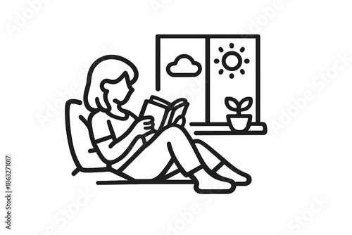 Person reading a book by the window