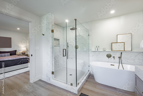 Fotografie Bright modern bathroom primary powder room sink glass wall shower free standing