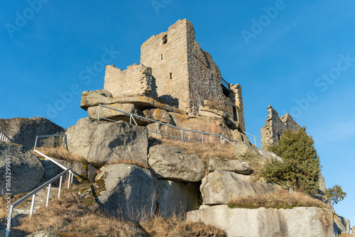 The medieval castle. The ruins of the castle on a winter evening? at sunset.