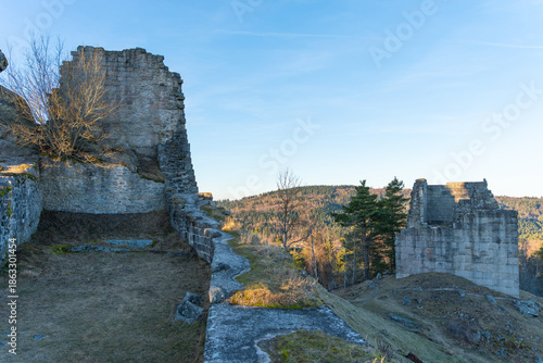The medieval castle. The ruins of the castle on a winter evening? at sunset.