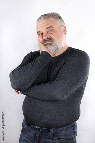Portrait of a bearded middle-aged man with gray hair