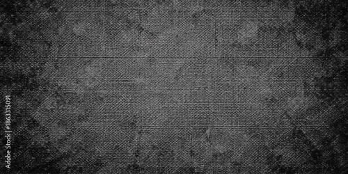 A dark and grungy vintage metal texture featuring a rough aged concrete pattern on a dirty gray stone surface for an antique wall backdrop design