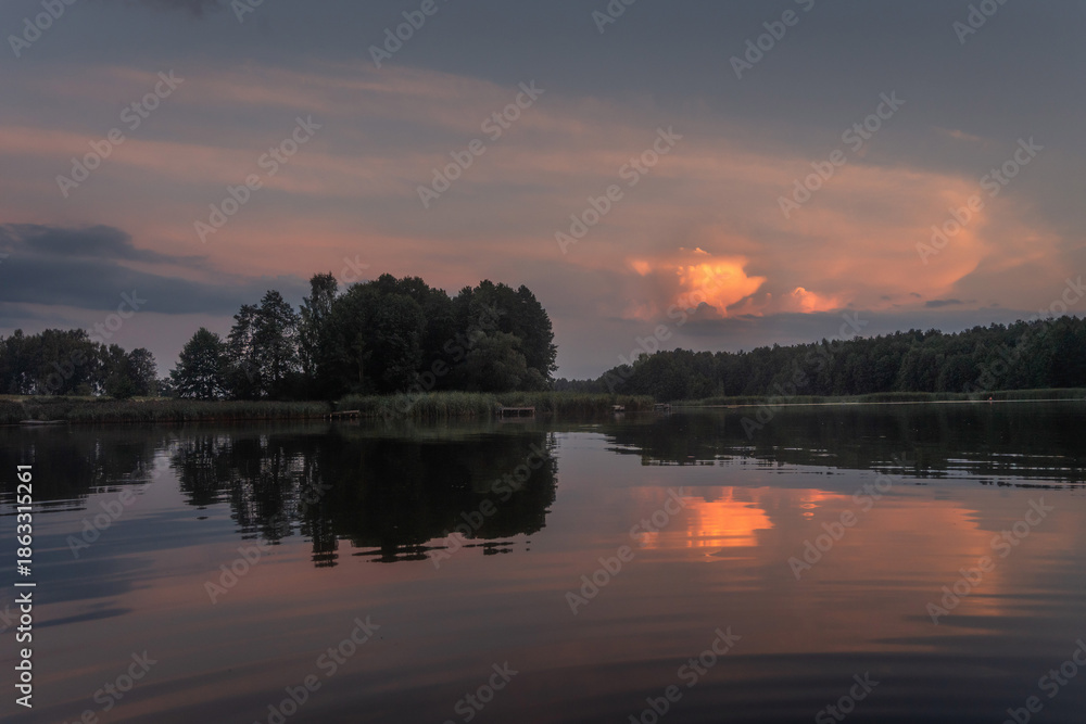 Obraz premium Colourful landscape of nature with lake sky and trees. Beatiful lakeside with reflections of sky in the water