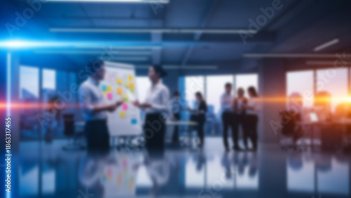 Wallpaper Mural Blurred business team brainstorming in a modern office, enhanced with colorful lighting. Creativity, collaboration, and innovation theme. Torontodigital.ca