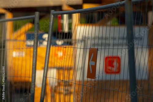 Bilde på lerret close up fence arrow with container backdrop, contractor checking route while eq